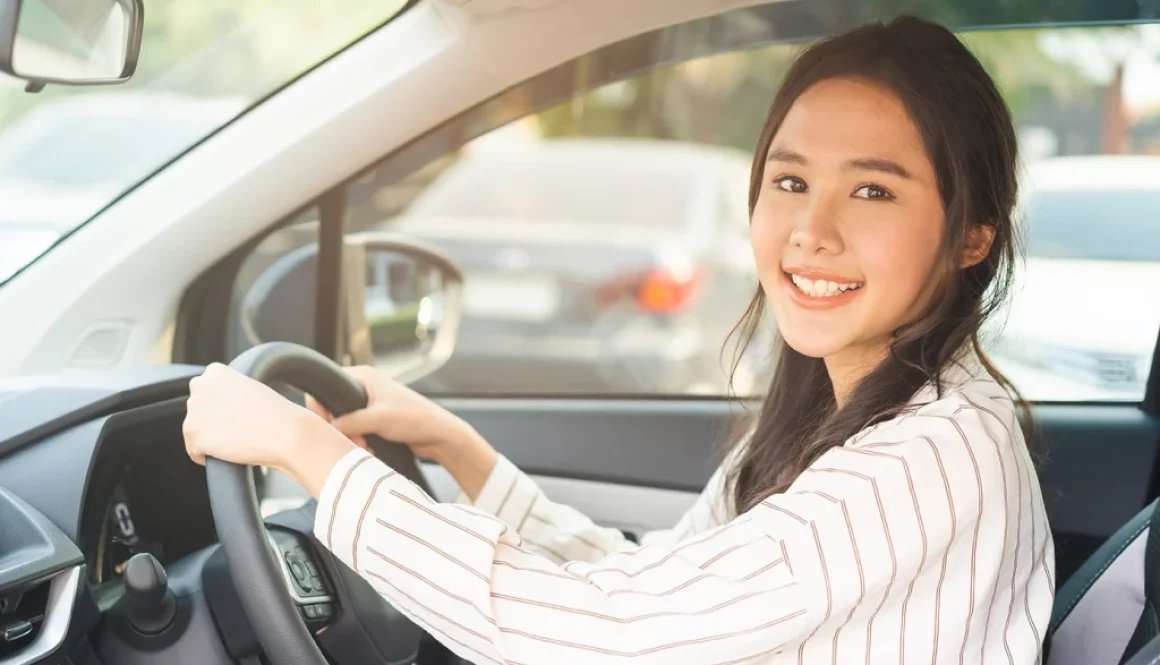 Young driver smiling